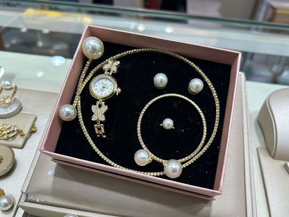 Conjunto de joyas dorado con perlas aleatorio.